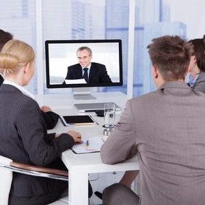 30069155 - group of business people in video conference at meeting table